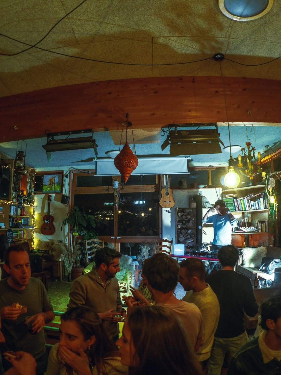 The El Payo room on a Tiny Desk & Pintxos night — crowd, string lights and a live set.